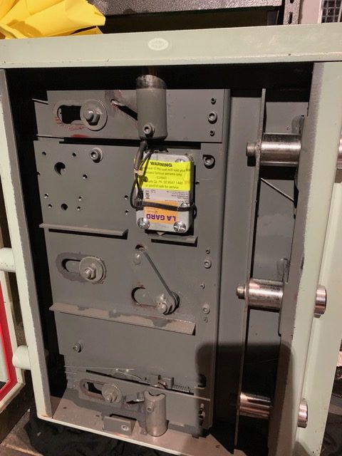 Commercial door locking mechanism opened up for repair